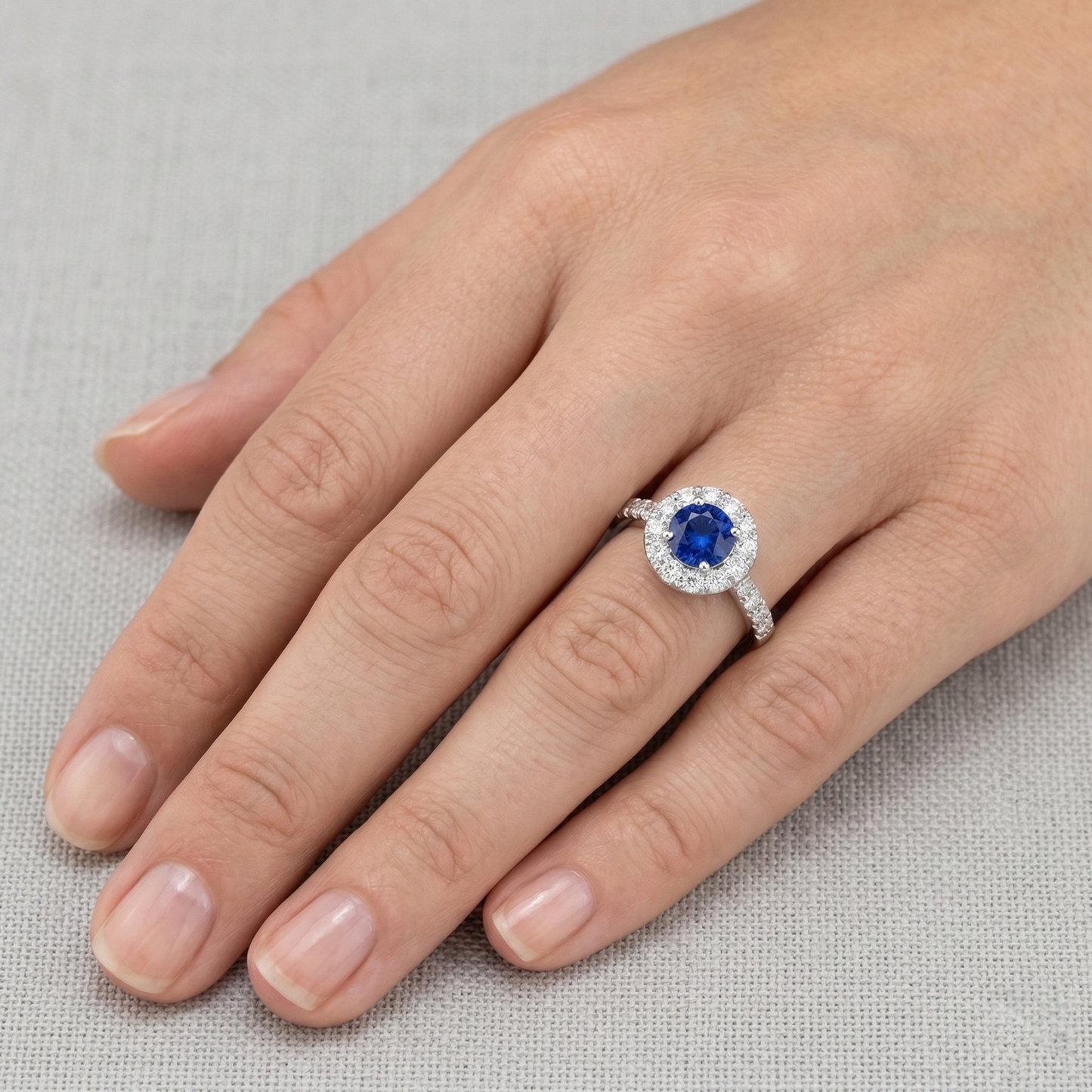 natural round sapphire 2ct ring on white background