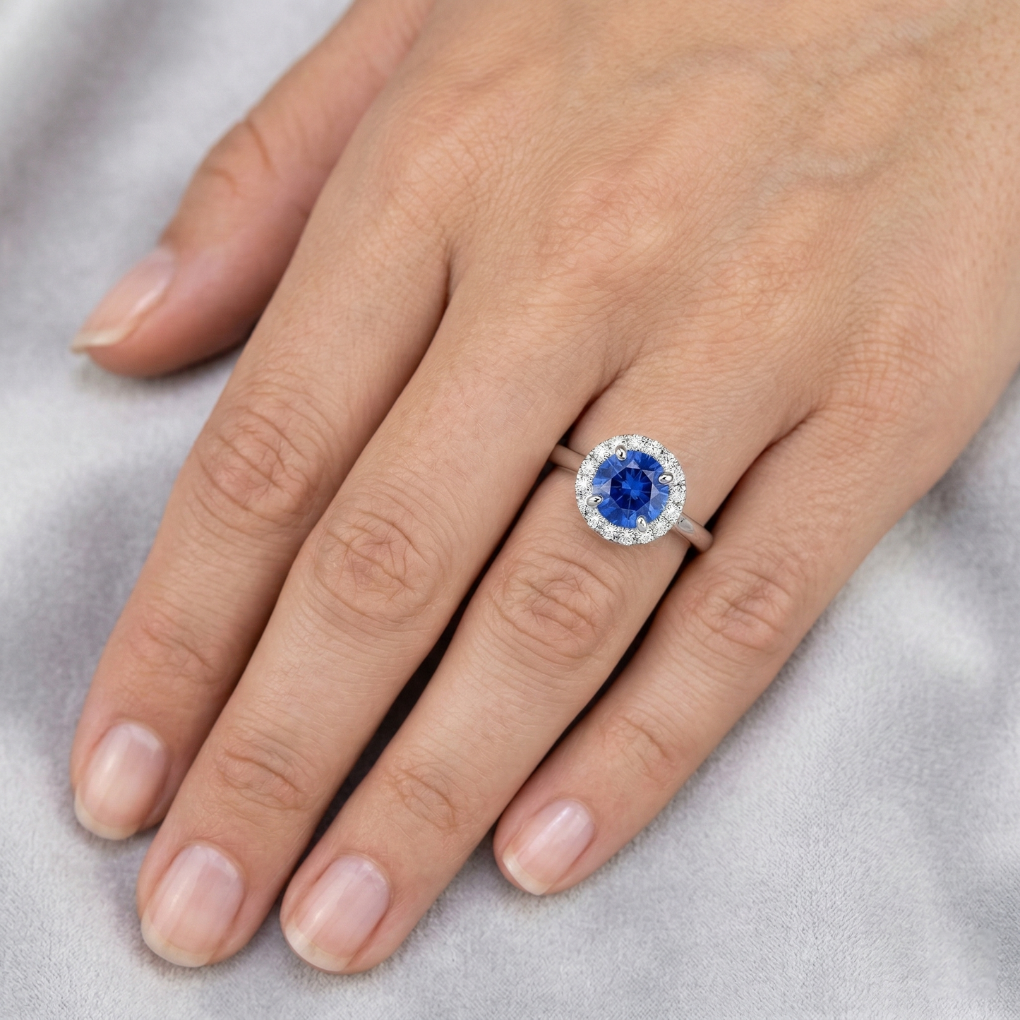 natural round sapphire 2ct ring on white background