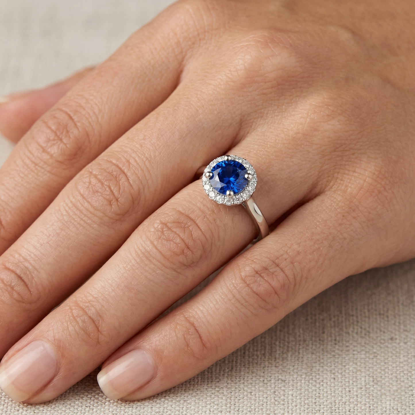 natural round sapphire 2ct ring on white background