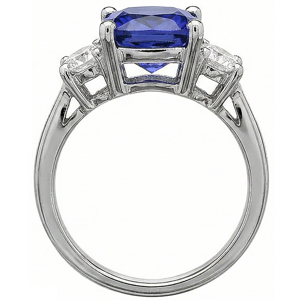 natural round tanzanite 4.51ct ring on white background