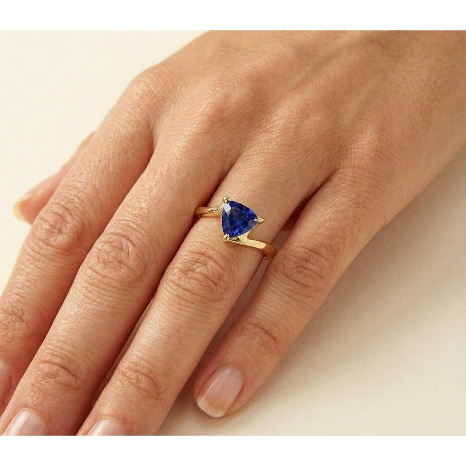 natural trillion sapphire 1ct ring on white background