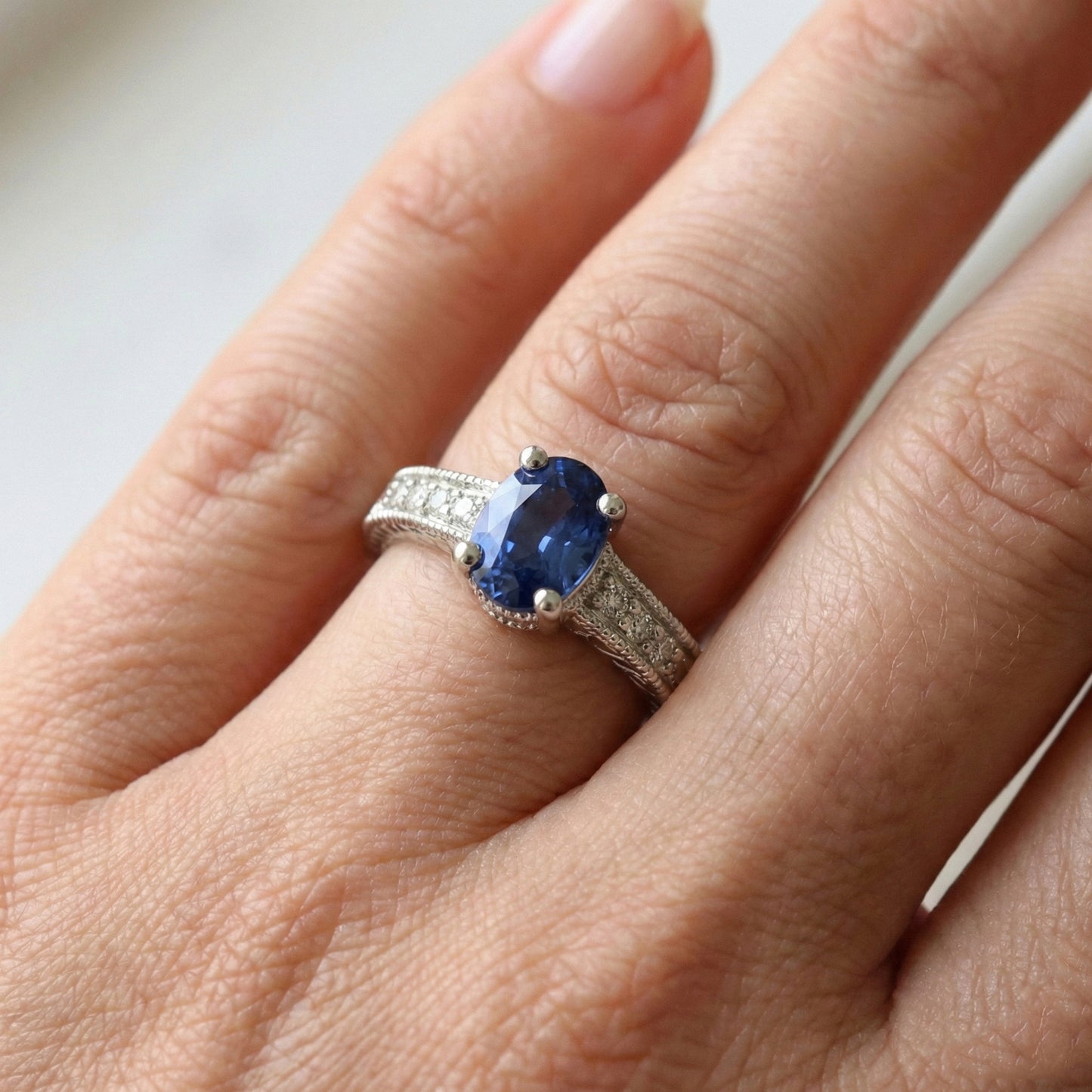 natural round sapphire 2ct ring on white background