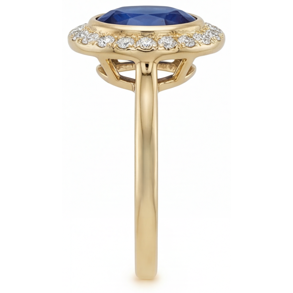 Oval Cut Royal Blue Sapphire ring in 14 Karat Yellow Gold – profile view
