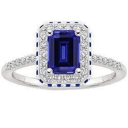 Diamond Halo Ring With Blue Sapphires on Side Emerald 4.25 Carats